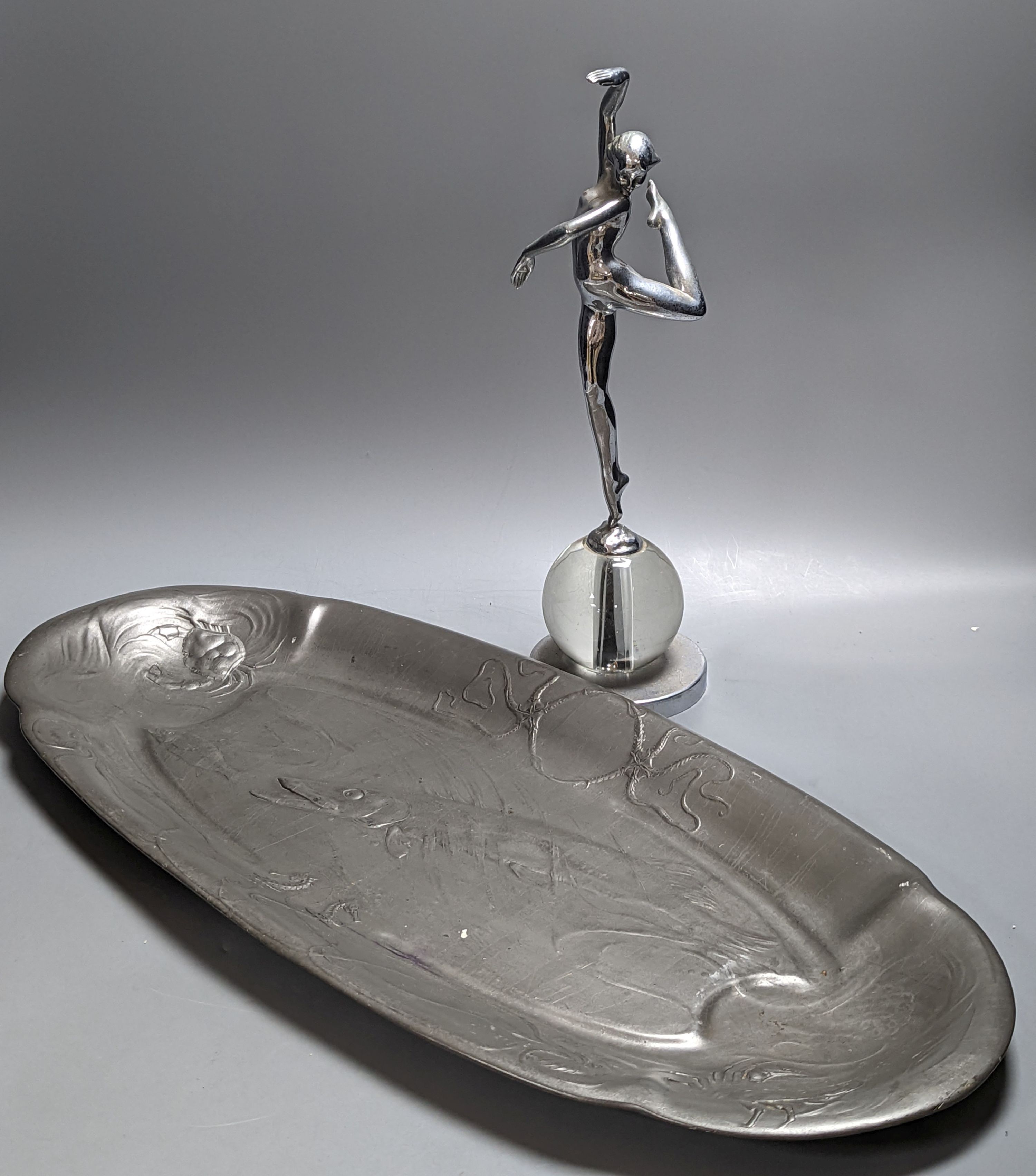 A Kayserzinn oval salmon dish and an Art Deco chromium female statuette 62cm
